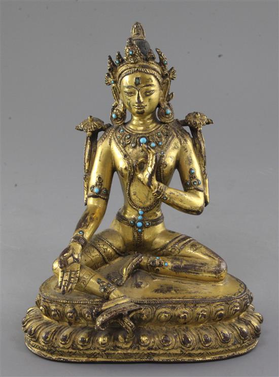 A Tibetan gilt copper alloy figure of Green Tara, 14th-15th century, height 21.3cm
